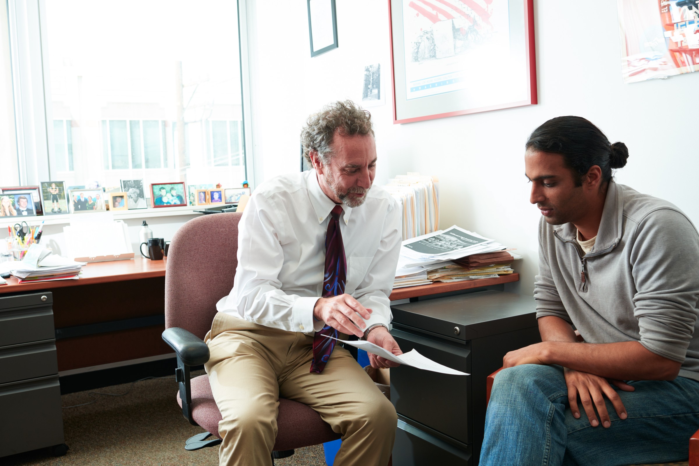 Faculty and student talking