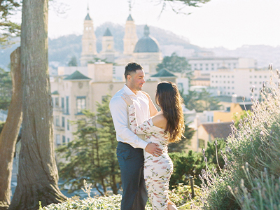 Couple embracing under a tree