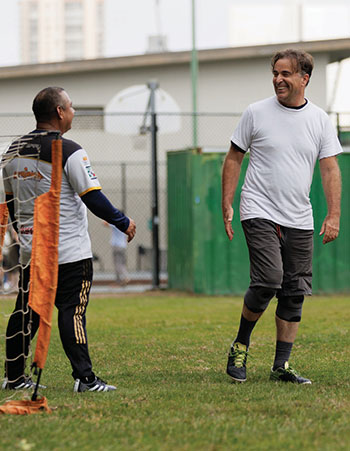 Two smiling soccer players.