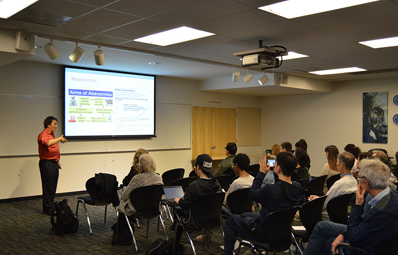 Dr. Watanabe sharing the results of his current research with the community during a public lecture