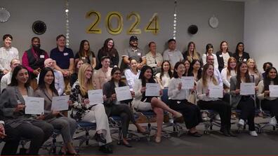 Students holding certificates