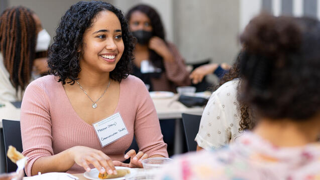 Students talk while eating.