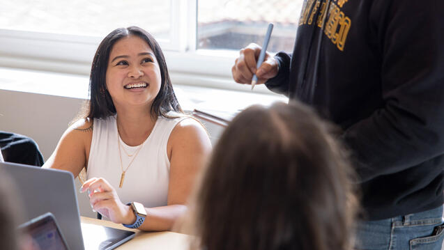 Student laughing and learning