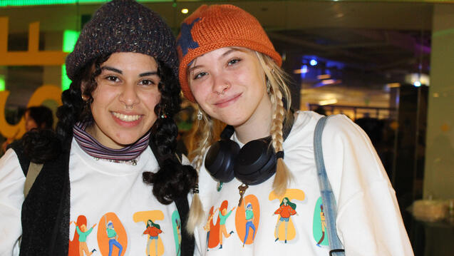 two students wearing vote shirts