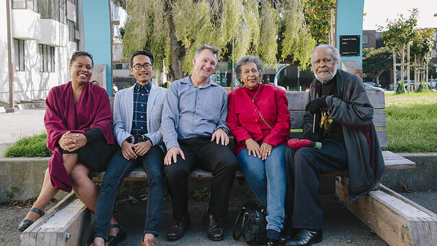 Group of people smiling.