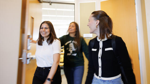 students walking through door