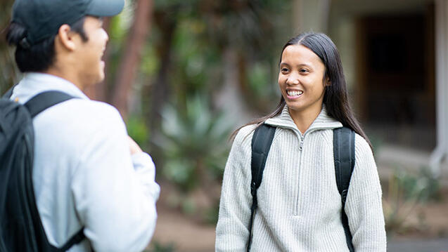 students laugh together outside