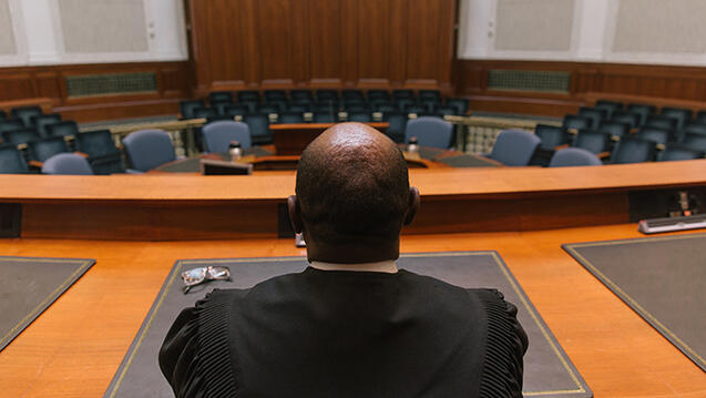 back of judge in courtroom