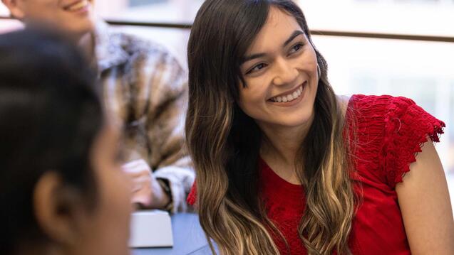 a girl in class smiling