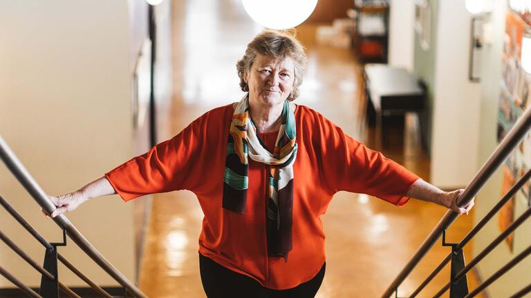 Martha Ryan walking up a staircase