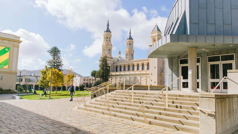 Stairs outside the library with the church in the background.