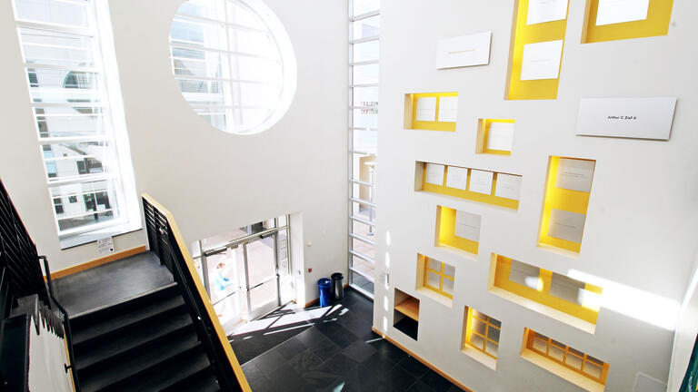 Lobby of Zief Library with a wall of colorful boxes.