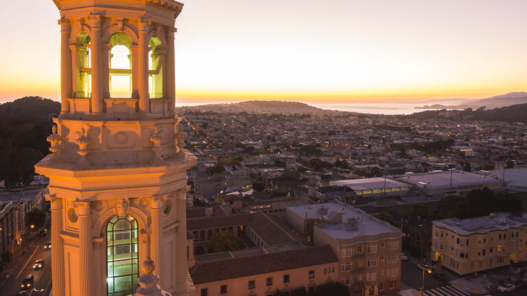 St Ignatius Church tower and sunset over the coast.