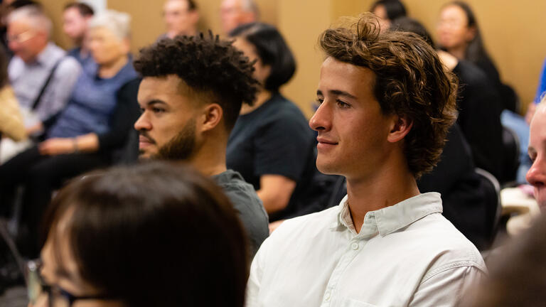 Students in a crowd at an event