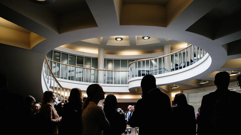 People gathered under rotunda of Kendrick hall