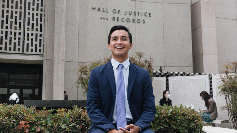 Lawyer in front of the Hall of Justice and Records