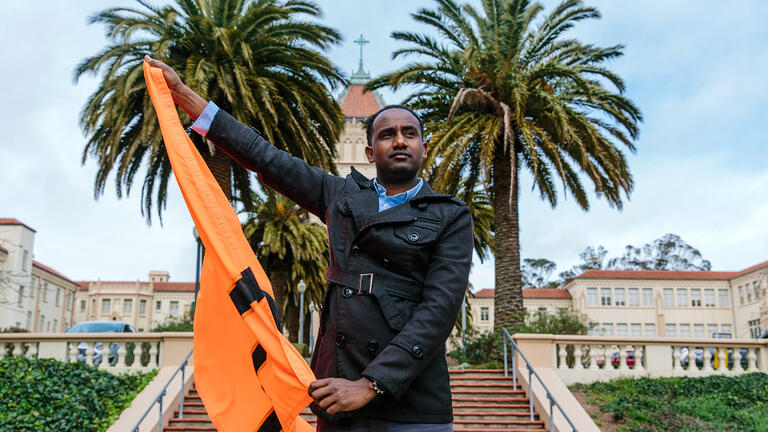 Meron Semedar holding a flag