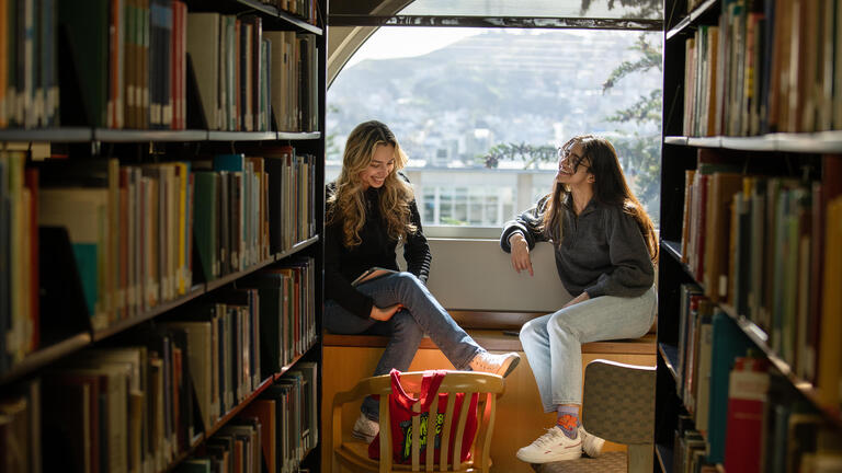 students sitting in the library