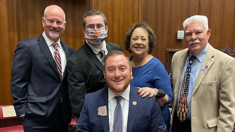 Flavio Bravo MA ’19, center, with family