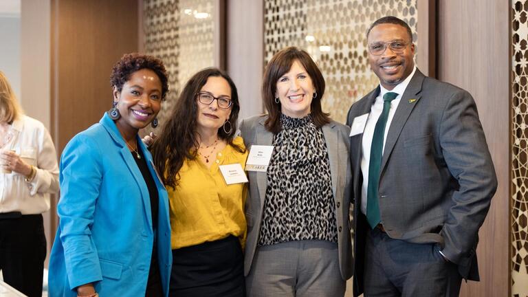 Women in Leadership and Philanthropy attendees posing for a photo at the symposium