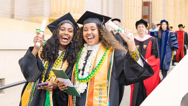 USF alumni in cap and gown