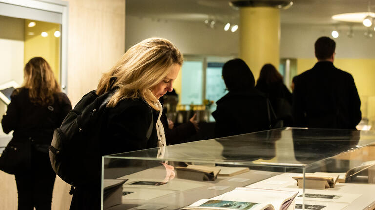 person looking at art display at the Thacher Gallery