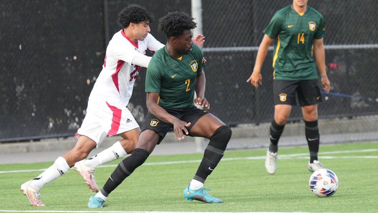 USF men&#039;s soccer player blocks opponent 
