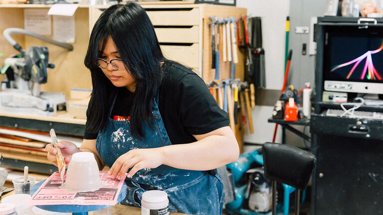 USF student working on pottery