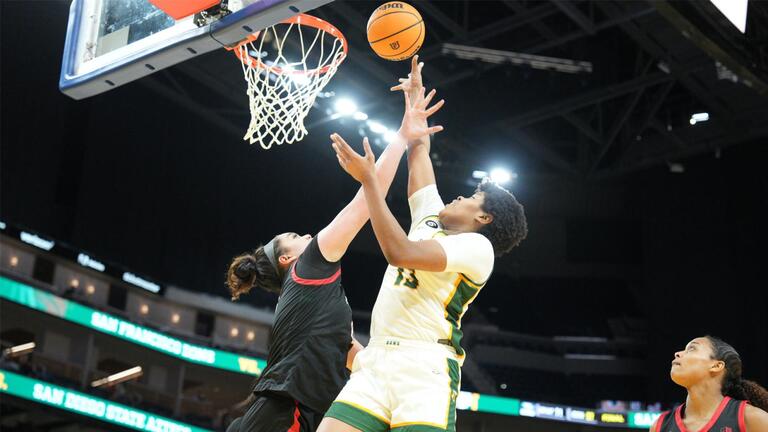 USF women&#039;s basketball player take a shot.