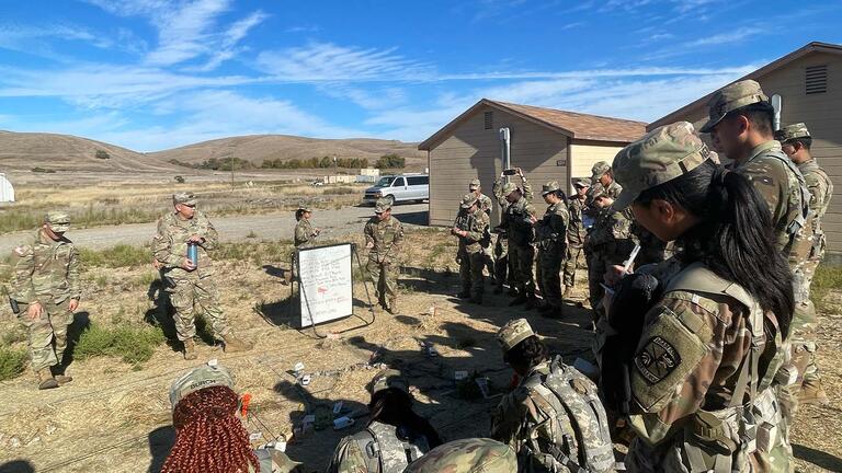 ROTC students looking at a board