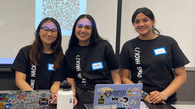 Student organizers pose at hackathon