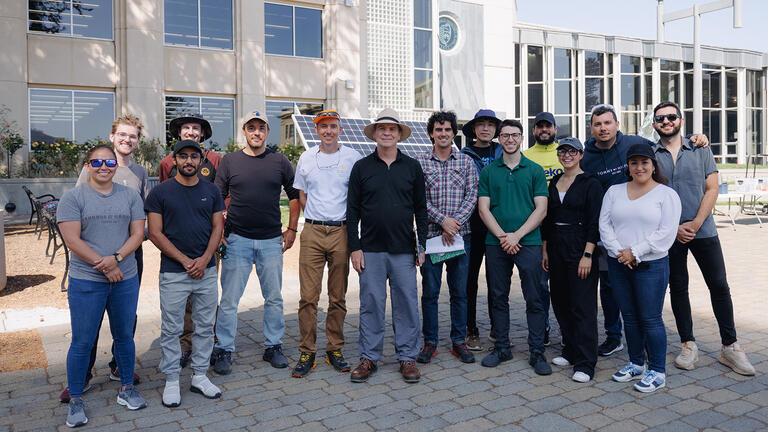 energy systems management students stand outside on usf campus