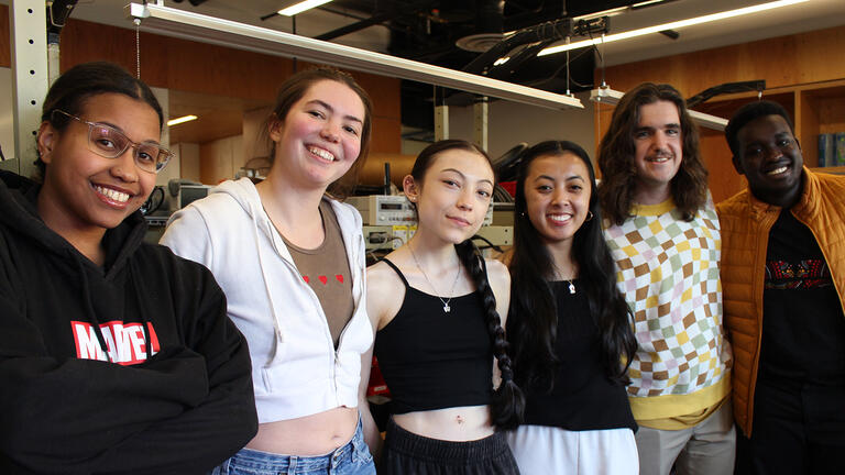 group of students pose together in the innovation hive