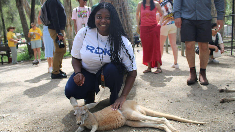 student pets kangaroo