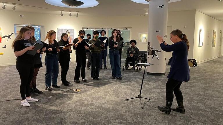 Choir performing in Thacher Gallery