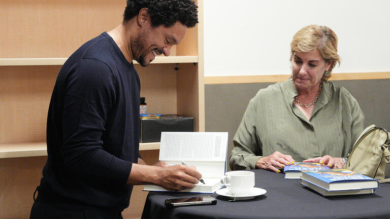 Trevor Noah signs his book “Born a Crime: Stories from a South African Childhood” 