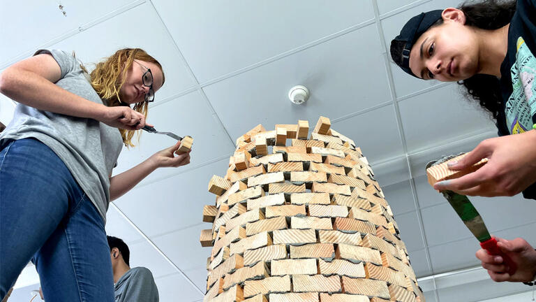 students testing a tower design