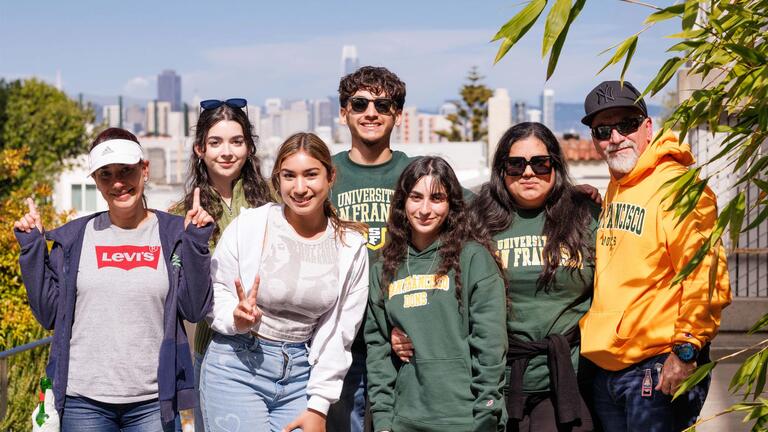 new students and there parents on campus with downtown sf in the background