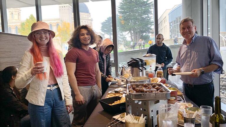 Students and professors at a luncheon