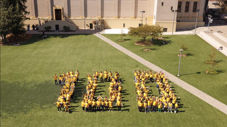 People formed in a 100 in Gleeson Plaza