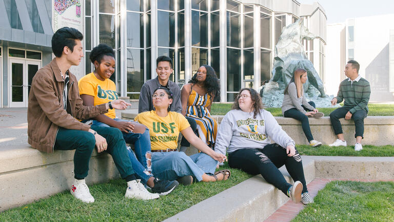 group of diverse students hanging out at gleeson plaza