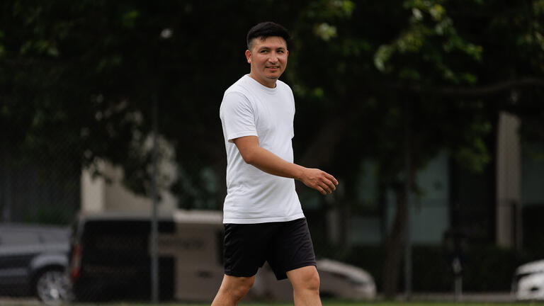 Soccer player walking.