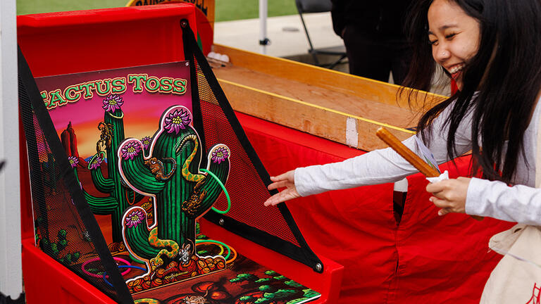 Student playing ring toss game