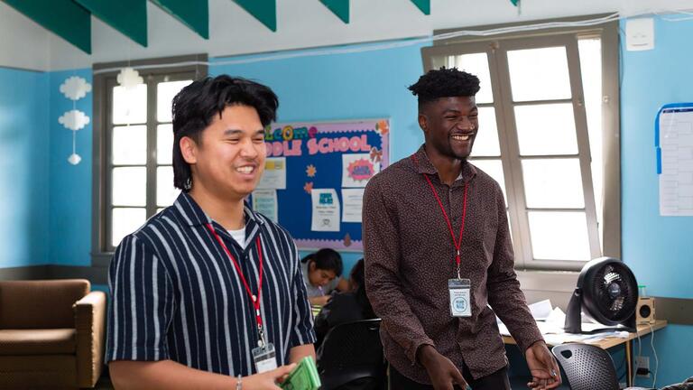Two students teaching in a classroom