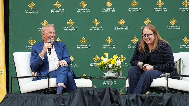 Kevin Costner on stage at the Silk Speaker Series during CelebrateUSF weekend with Brenna Malloy