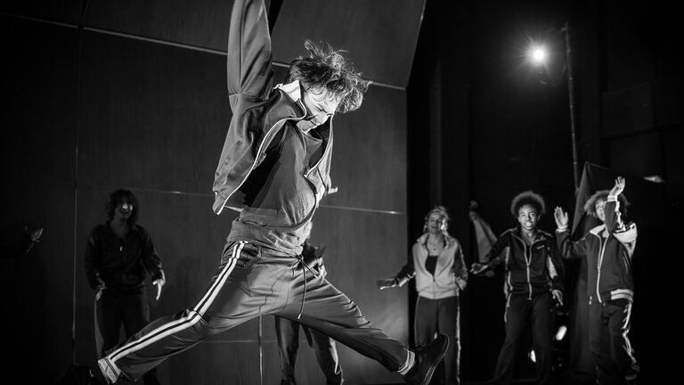 Black and white photo of student participating in hip hop performance