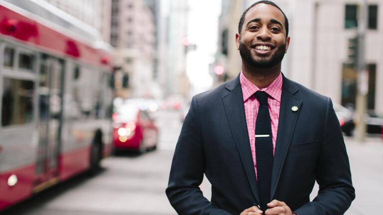 student with MUNI bus in background