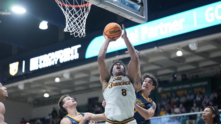 USF men's basketball player shooting a hoop