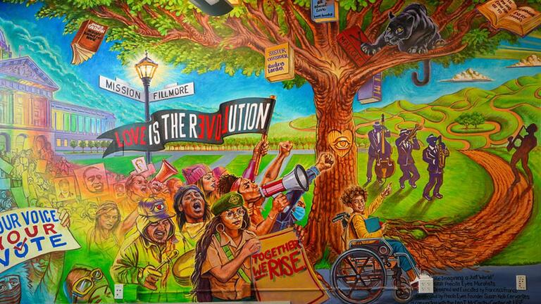 colorful mural with activists in front of tree 