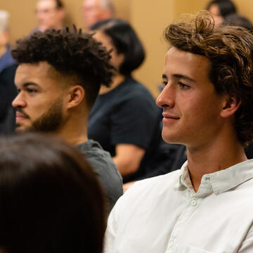 Students in a crowd at an event